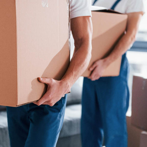 two members of a moving team in charge of white glove delivery service